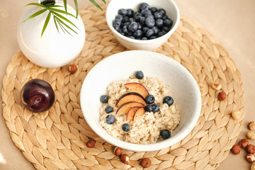 tasty porridge with blueberries, nuts, plums and chia seeds.