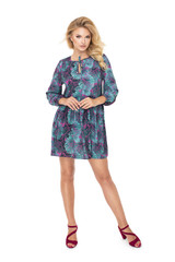 Attractive young fashion model wears a business dress in studio and smiling