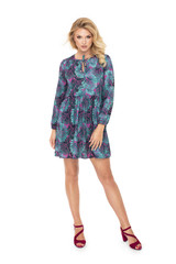 Attractive young fashion model wears a business dress in studio and smiling