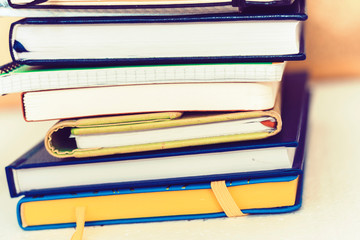 Notebooks piles, education back to school background with copy space for text.