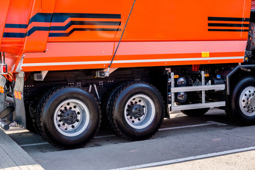 Big new orange truck standing on the road