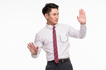 Man plays a role, that has wall in front of him..