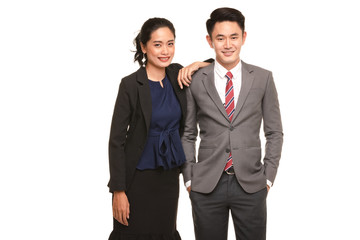 Two business people standing and posing..