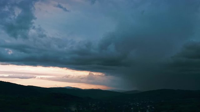 Extreme thunderstorm with several lightning strikes. Drone aerial footage.