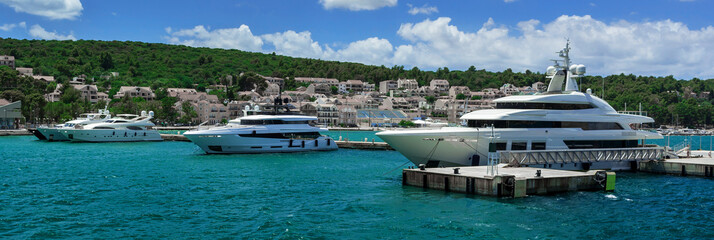 Multiple luxury yachts are anchored in the port of Argostoli © David Peperkamp