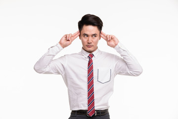 Man plays a role, that has wall in front of him..