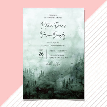 wedding invitation with misty green forest watercolor background