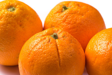 Bunch of four Organic orange Oranges close up