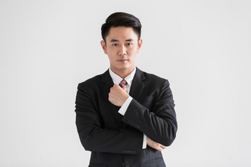 Businessman standing and crossed his arm..