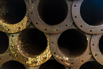 Stack of rust metal pipeline in factory.