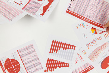 Flat top view of businessman working and calculating finance, reads and writes reports. Business financial accounting concept.