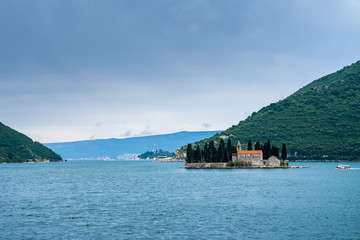 Fototapeta premium Montenegro, Small islet of Saint George Benedictian monastery on St. George island Ostrvo Sveti Dorde at coast of perast old town, a popular tourist attraction