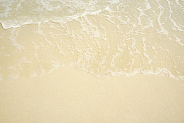 Tropical beach with white coral sand and calm wave with space for text background                   