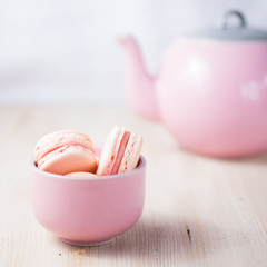Pink macarons in a bright neutral setting