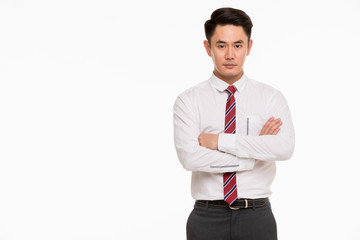 Young Asian businessman crossed arms..