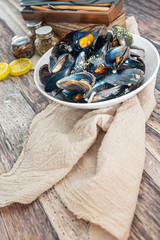 Mussel with white wine sauce on table