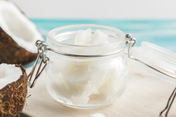 Coconut butter on wooden background. Organic healthy food concept