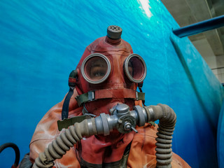Vintage diving mask with whole body suite cover.