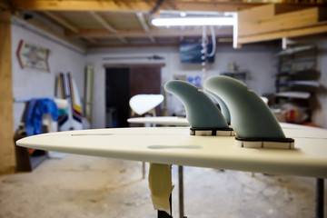 surfboard fins in the workshop