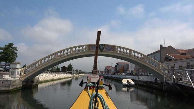 Sightseeing in a moliceiro, Traditional boat in Aveiro, sailing on the canal in Aveiro, Portugal