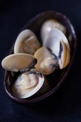 Sea aperitifs on a dark rustic background. Shellfish background