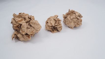 Crumpled brown paper.It is mauled on white background.