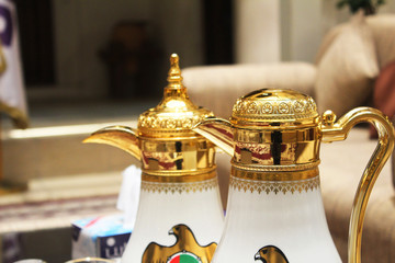 traditional arabic qahwa and coffee pots in gold color