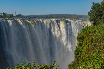 picture of the Victoria Falls and a rainbow while beautiful sunlight