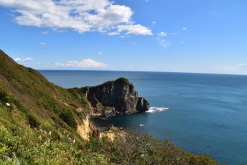 Fototapeta na wymiar The view of the sea and mountains in Hokkaido, Japan
