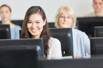 Asian student in computer course
