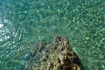 Turquonise water on Kape beach near Athens, Aegean sea, Greece. 