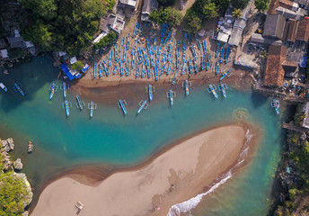 Aerial: Fishing village at Sepanjang beach, Java island,Indonesia