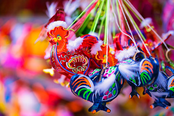 Obraz premium Colorful of tradition lanterns hanging on street in chinatown lantern market, Saigon, Vietnam. Many kind of beautiful plastic lanterns in Mid Autumn Festival. National and cultural holiday.