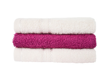 Pink and white bath towels in stack isolated over white background with clipping path