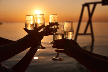 hen party before the wedding. girls relax at the resort. early morning friends drink champagne and...