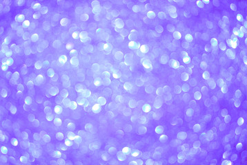 Violet bokeh as abstract background. Defocused lights. Festive concept. Selective focus.
