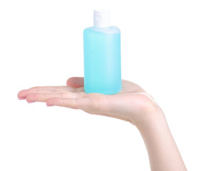 Bottle acetone nail polish remover in hand on white background isolation