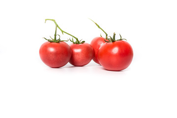 Cherry tomatoes. Three cherry tomatoes isolated on white background