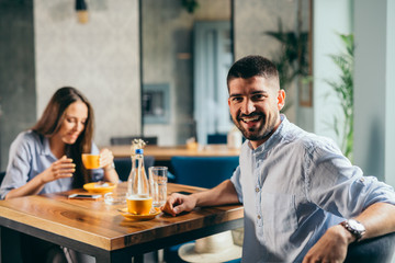 handsome man with his girlfriend in cafeteria
