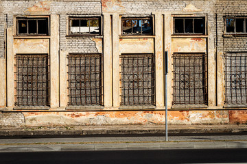 Aged street wall with some windows