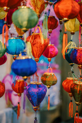 Fototapeta na wymiar Colorful tradition lantern at china town lantern market in saigon, Vietnam. Beautiful Chinese lanterns and Many kind of tradition lanterns are hanging on street market in mid autumn festival. 
