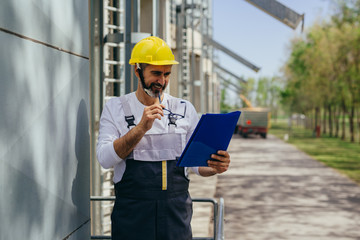 worker controlling grain load in factory