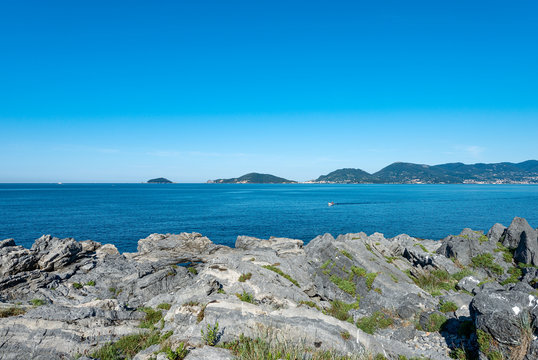 Mediterranean Sea in the Gulf of La Spezia with the Portovenere or Porto Venere town and the Palmaria, Tino and Tinetto Islands. Liguria region, Italy, Europe