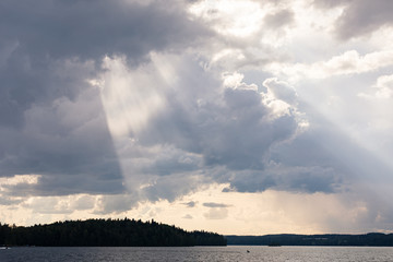 Obraz na płótnie Canvas Vivid sunbeam light ray from clouds