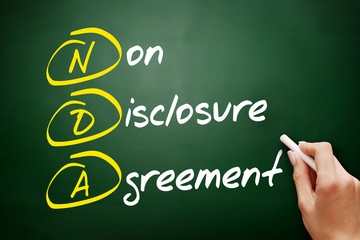 NDA - Non-Disclosure Agreement acronym, business concept on blackboard