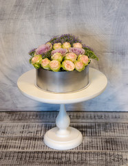 wedding cake with silver chocolate border and roses
