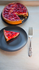 Classic cheesecake with strawberry slices in jelly on top.