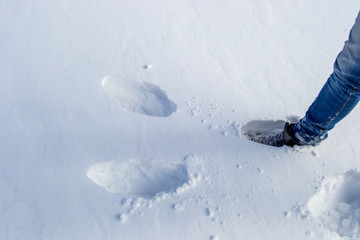 Snow and a foot on it