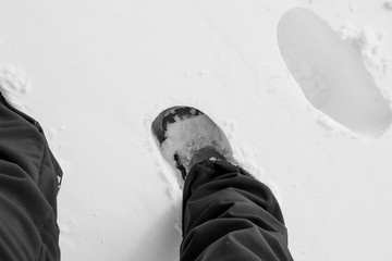 Snow and a foot on it