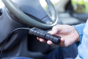 Man using car diagnostic scan tool